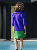 Stylish blue Shift Code dress adorned with a tulip pattern, ideal for warm weather gatherings or everyday wear.