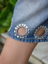 enim shorts poses outdoors, exuding a relaxed and cheerful vibe.
