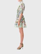 Elegant short dress with elasticated waist and blouson sleeves, featuring a floral print inspired by the Bergl Rooms in Vienna.