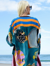 "As You Like It" shirt adorned with a whimsical multi-fish print, ideal for a cheerful outfit.