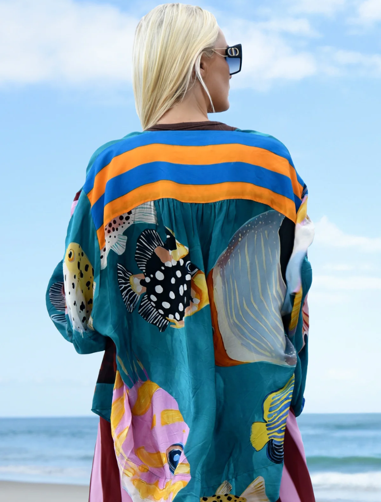 "As You Like It" shirt adorned with a whimsical multi-fish print, ideal for a cheerful outfit.