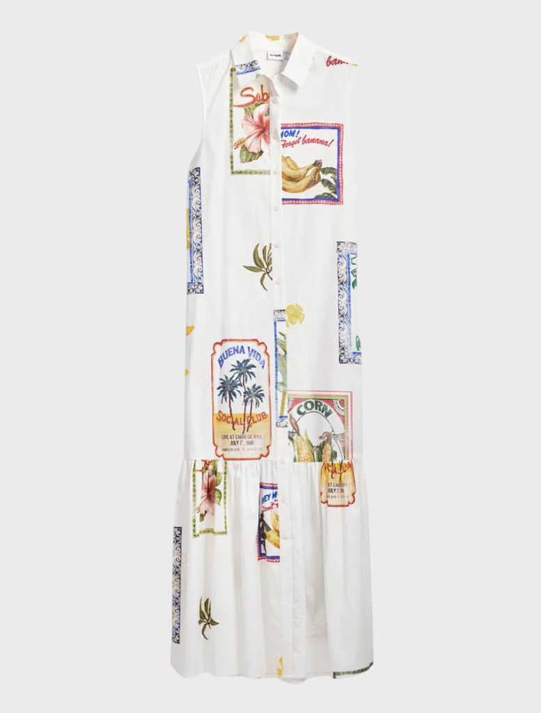 A white dress displaying a cheerful, colorful print across its surface.