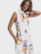A white dress showcasing a bright, multicolored print pattern.