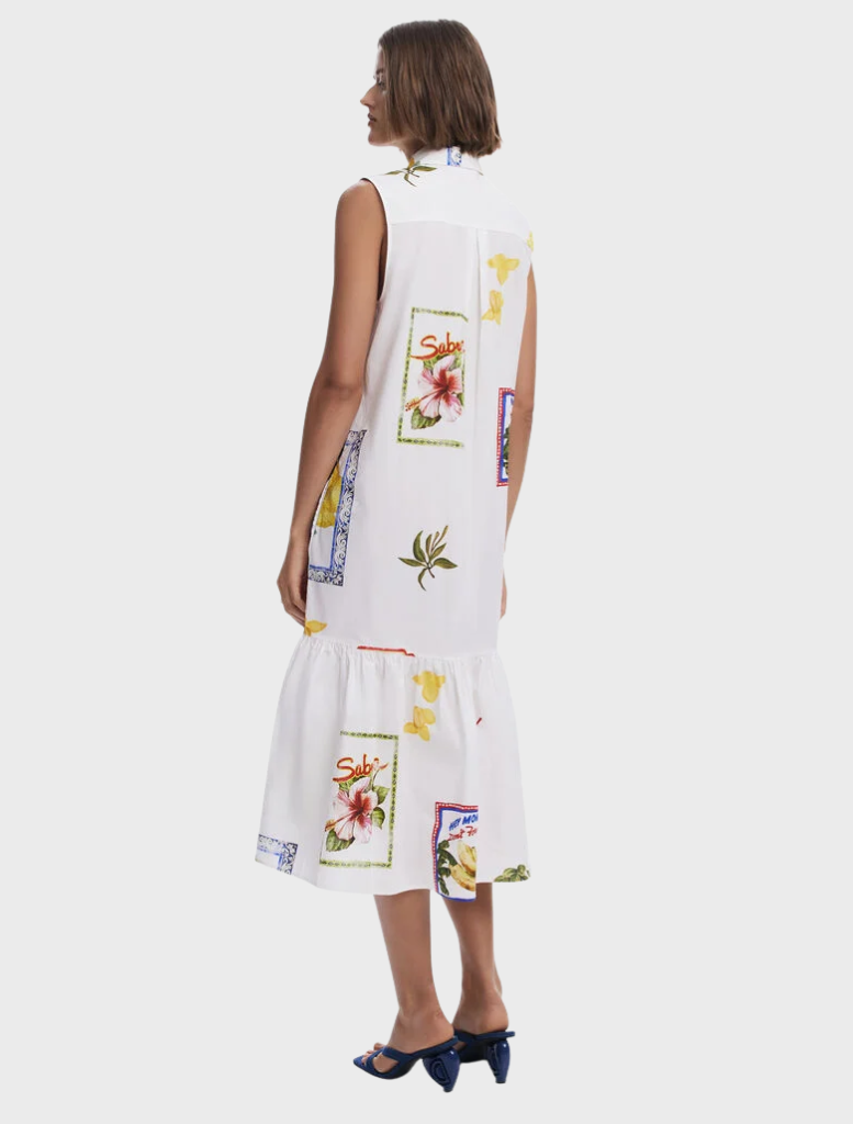A white dress showcasing a bright, multicolored print pattern.