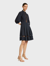 Chic navy short dress from Olivia, showcasing a modern design suitable for both day and night wear.