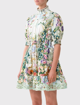 Fit and flare short dress with a shirred waist and elbow-length sleeves, adorned with a floral print inspired by Schonbrunn Palace.