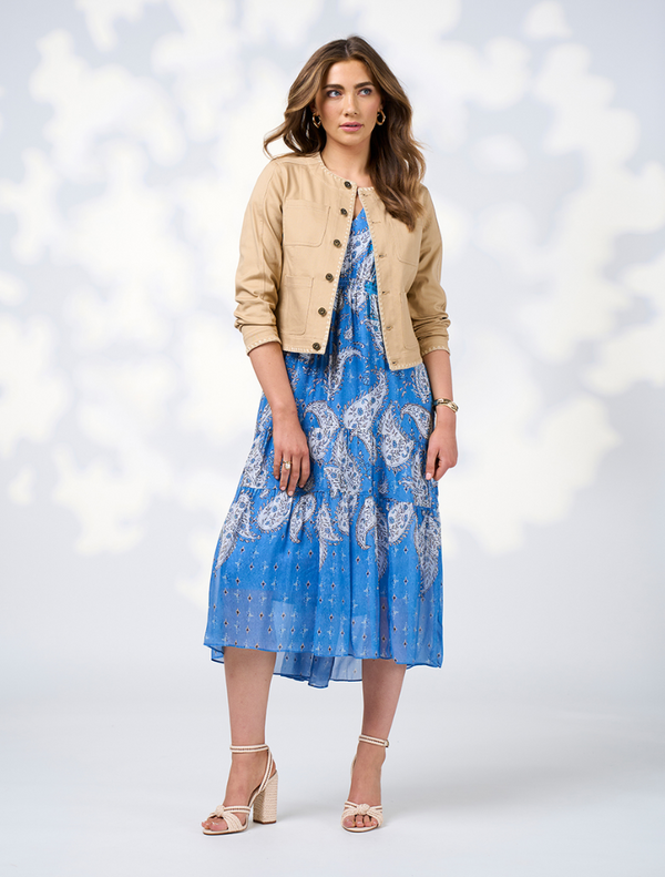 A blue dress adorned with a delicate floral pattern, highlighting its elegant and stylish design.