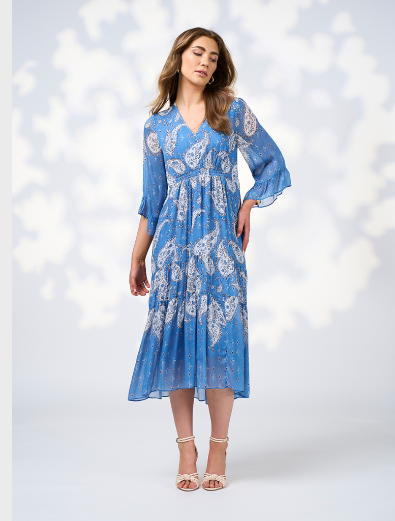 A blue dress featuring a vibrant floral pattern, showcasing a blend of colors and intricate designs.