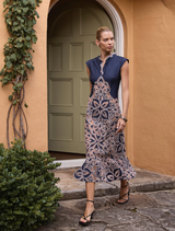 Sierra Midi dress in navy and blush, featuring a flowing silhouette and elegant design suitable for various occasions.