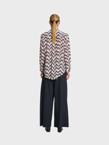 Soft pleated shirt, showcasing a refined look with a comfortable fit, ideal for various occasions.