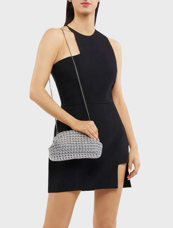 A stylish silver clutch bag adorned with a distinctive chain design, ideal for adding flair to any outfit.
