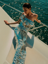 Silver Tamzin gown featuring a sleek design and graceful draping, ideal for special events and formal gatherings.