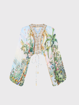 Blouson sleeve silk blouse with lace-up detail, featuring a lilac landscape print inspired by Hofburg Palace frescoes.