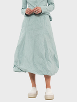 Mint poplin skirt featuring a vibrant print, showcasing a stylish and modern design suitable for various occasions.