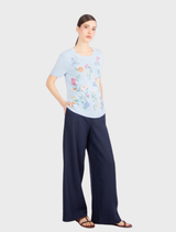 Short-sleeve pullover in sky blue, showcasing beautiful floral embroidery, crafted from comfortable pure viscose material.