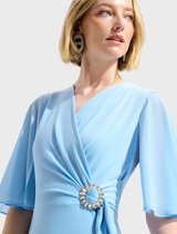 Stylish V-neck wrap midi dress in sky blue, designed for comfort and elegance, perfect for day or evening wear.