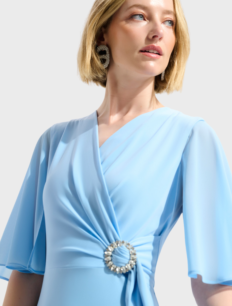 Stylish V-neck wrap midi dress in sky blue, designed for comfort and elegance, perfect for day or evening wear.