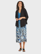  A model showcases a blue and black floral print Dress, highlighting its vibrant colors and stylish design.