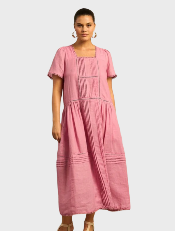 A flowing dress with a vibrant skyscape pattern in shades of blue and pink, perfect for summer outings.
