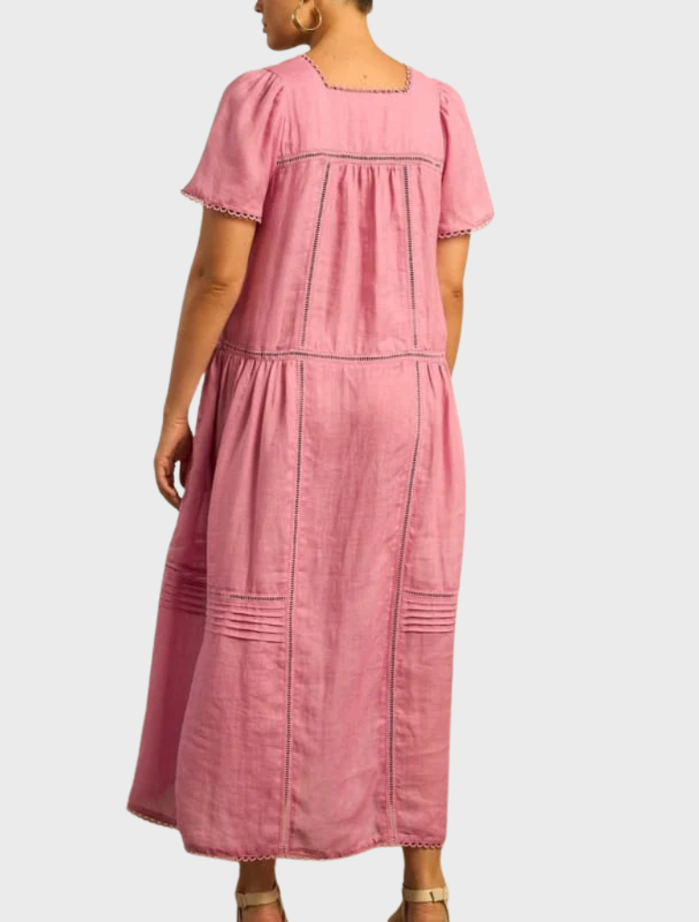 A chic dress adorned with a colorful skyscape design, featuring a blend of blue and pink tones for a fresh appearance.
