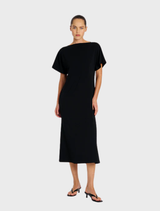 Black slash neck dress with a fitted silhouette, featuring short sleeves and a stylish, modern design.