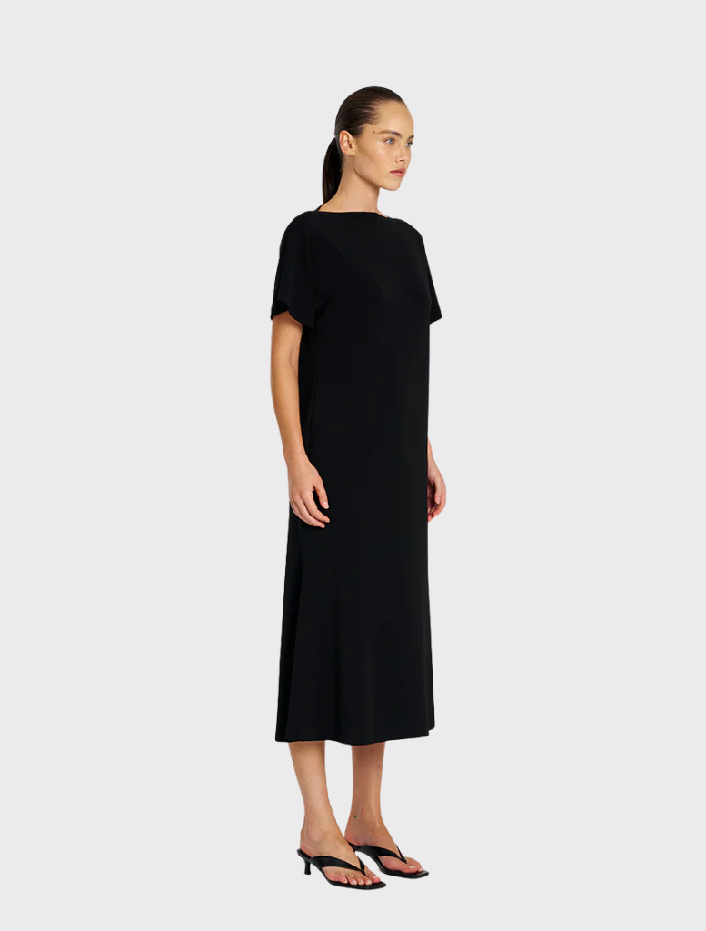 Black dress featuring a slash neckline and short sleeves, offering a fashionable and fitted style for various events.