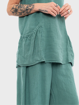 A vibrant green tank top laid flat, emphasizing its casual design and lightweight fabric.