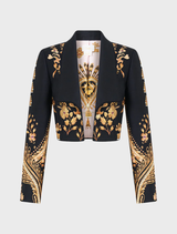 Elegant silk-wool cropped jacket with a slim fit, influenced by matador costumes, highlighting rich textures and tailored design.