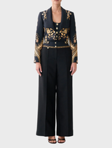 Slim fit cropped jacket in silk-wool blend, inspired by matador costumes, featuring a tailored silhouette and intricate texture.