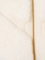 Trendy short sleeve slouch jacket in faux fur, adorned with a tiled pattern, ideal for adding warmth and style.