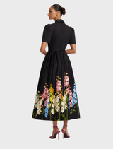 Bianca short sleeve midi dress adorned with a vibrant snapdragon print in ebony, ideal for casual or formal wear.