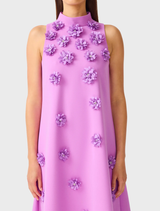 Elegant purple halter maxi gown with floral detailing, keyhole back, and relaxed fit, perfect for formal events and weddings.
