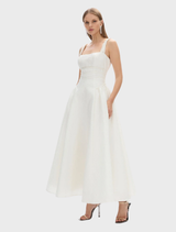 Sophisticated ivory strap dress from Sophia, designed with a fitted bodice and a soft, flowing skirt for a chic look.