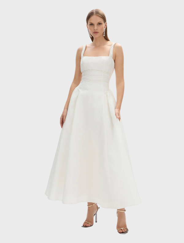  Ivory Sophia strap dress featuring a fitted bodice and flowing skirt, perfect for formal occasions or summer events.