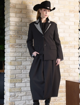 Timeless black jacket showcasing a refined silhouette, perfect for both casual and formal occasions.