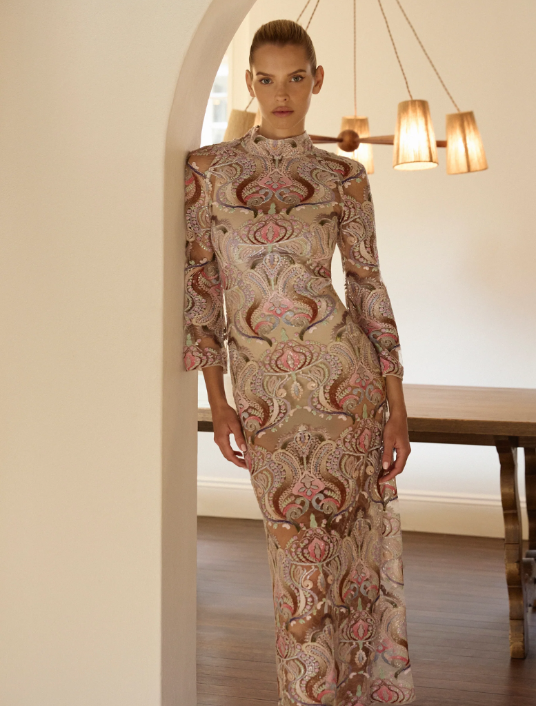 Elegant Paloma Midi dress in sorbet-nude, showcasing a flattering fit and gentle draping for a sophisticated look.
