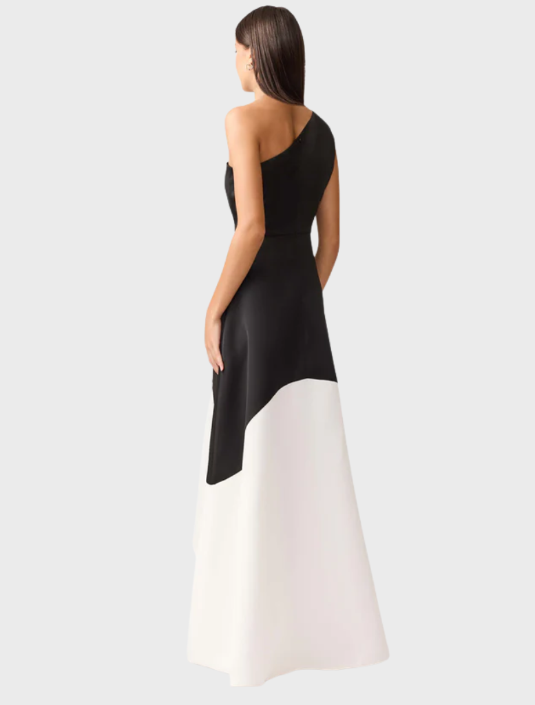 This black and white dress is elegantly made from one piece of fabric, emphasizing its simple yet chic design.
