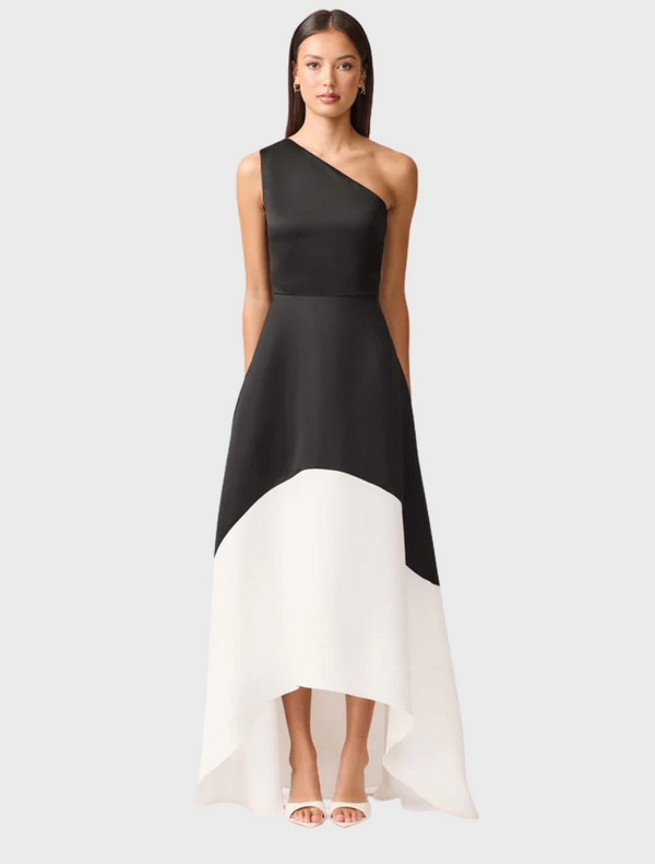 A black and white dress crafted from a single piece of fabric, showcasing a seamless and elegant design.
