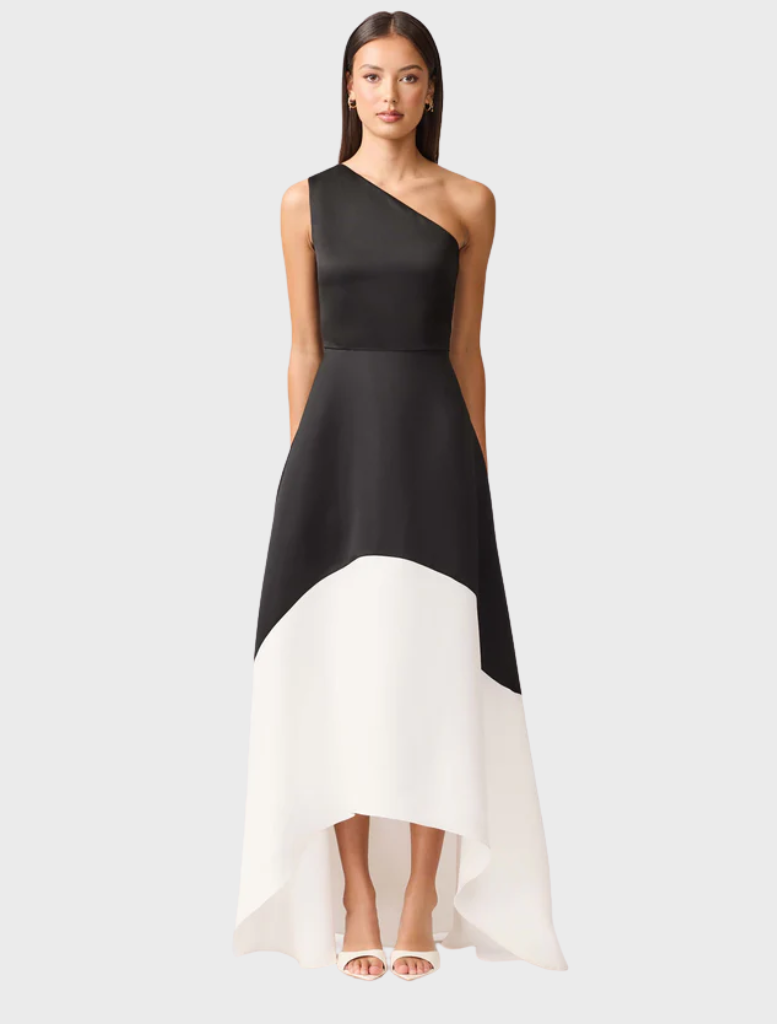 A black and white dress crafted from a single piece of fabric, showcasing a seamless and elegant design.