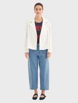 Tailored white jacket with a wide lapel, four-button closure, and elasticated back panel for comfort and style.