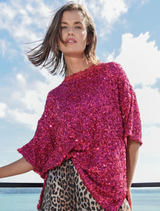Raspberry t-shirt with sequins, lace trim, and side vents for comfort and style, designed to make a bold statement.