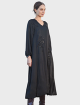 Glamorous black dress with a sparkling finish, designed to enhance the silhouette for a stylish night out.