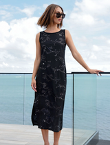 Black Sparkling Darling Dress featuring subtle sequins, a relaxed silhouette, and side splits for effortless movement.