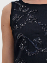 Sparkling Darling Dress in black, showcasing sequins, a relaxed shape, and side splits for stylish movement.