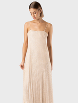 A shimmering slip dress inspired by the Gatsby aesthetic, featuring a luxurious glittery texture and elegant cut.