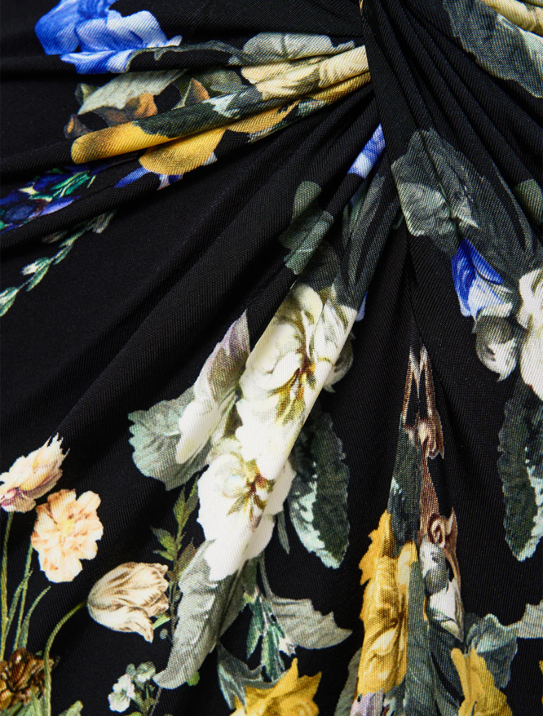 Ottoman elegance in a long dress with a split front and twist detail, perfect for formal occasions.