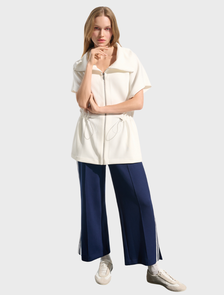 Sporty off-white jacket, hip-length design, blending fashion and function for an active wardrobe.