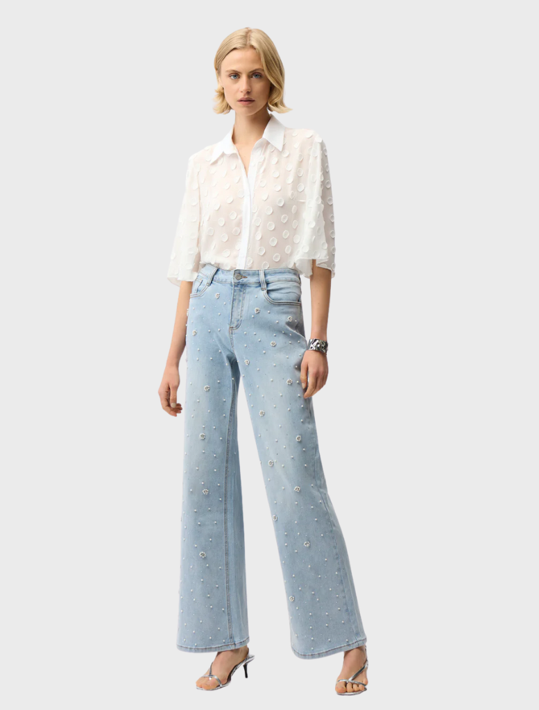 Light blue denim spring pants displayed on a white background, showcasing a casual and stylish design for warmer weather.