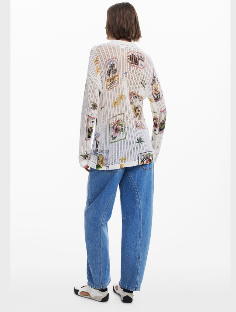 The model sports a white shirt with an eye-catching floral print.