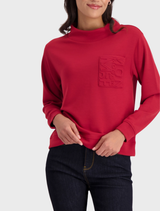 Stand-up collar top in chimney red, featuring a sleek design suitable for casual or formal occasions.